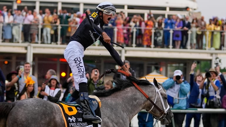 Jaime Torres, atop Seize The Grey, reacts after crossing the...