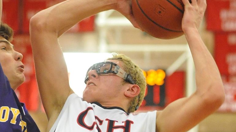 Jack Vavassis #34 of Cold Spring Harbor looks to get...