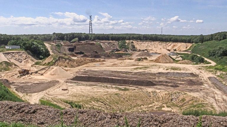 Mining operations at the Noyac sand mine, known as Sand Land,...