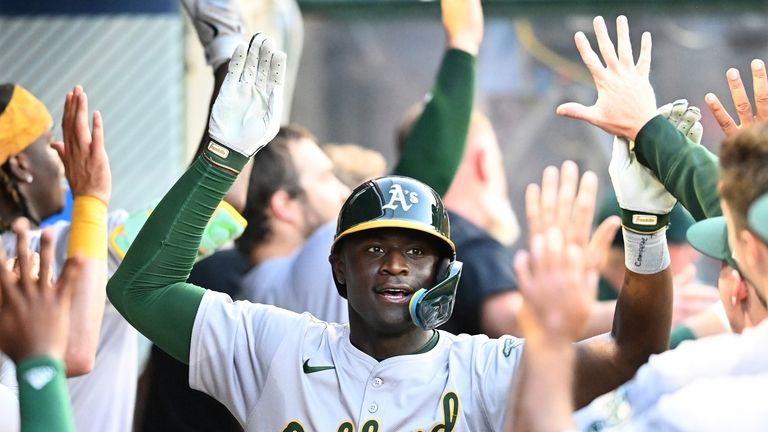 Oakland Athletics' Daz Cameron (28) is congratulated after his two-run...