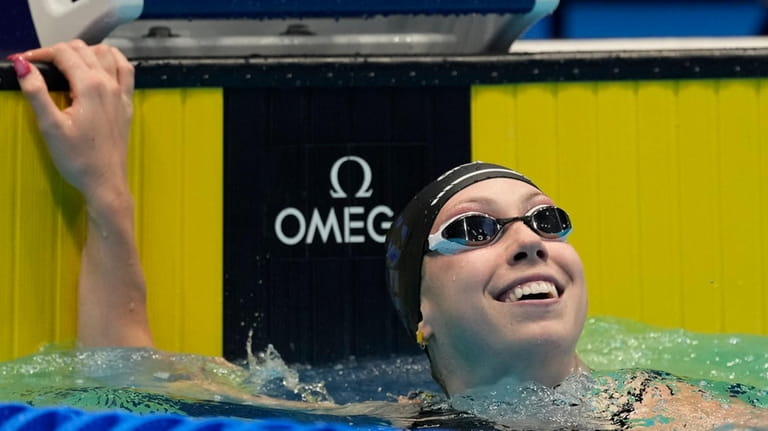 Gretchen Walsh smiles after a Women's 50 freestyle semifinals heat...