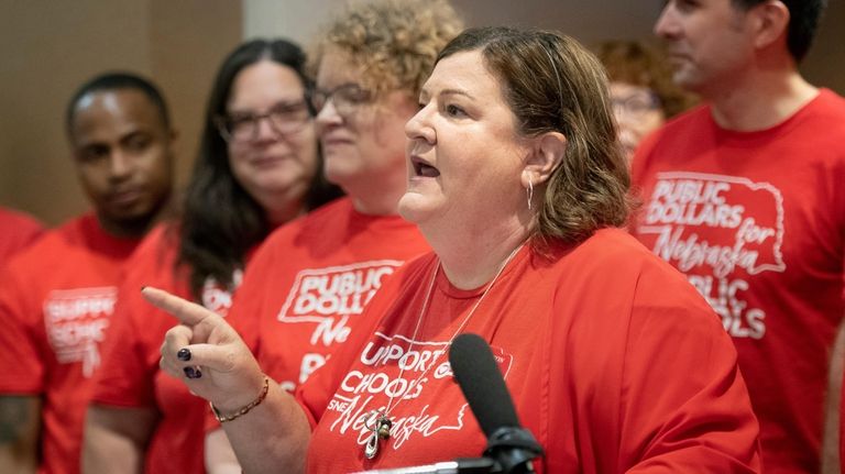 Jenni Benson, president of the Nebraska State Education Association, speaks...