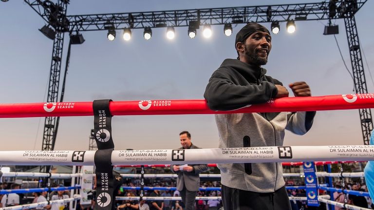 American boxer Terence Crawford poses for a picture after conducting...