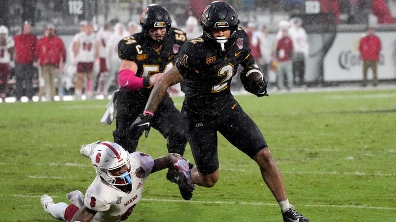 Appalachian State wide receiver Kaedin Robinson (2) runs past Miami...