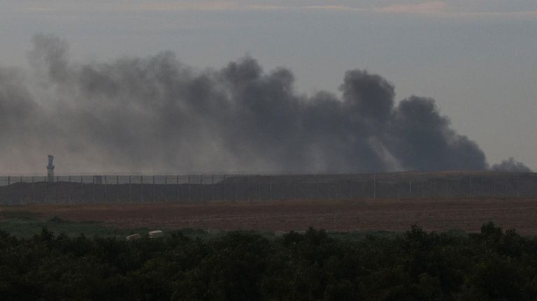 Smoke rises after an explosion in the Gaza Strip as...