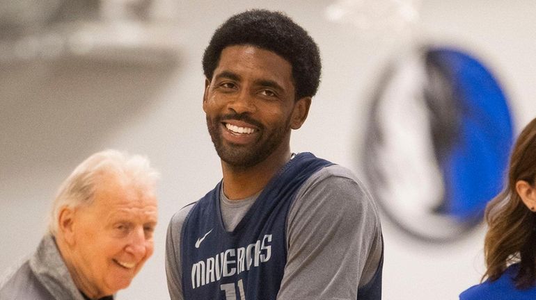 Dallas Mavericks guard Kyrie Irving heads off the court during...