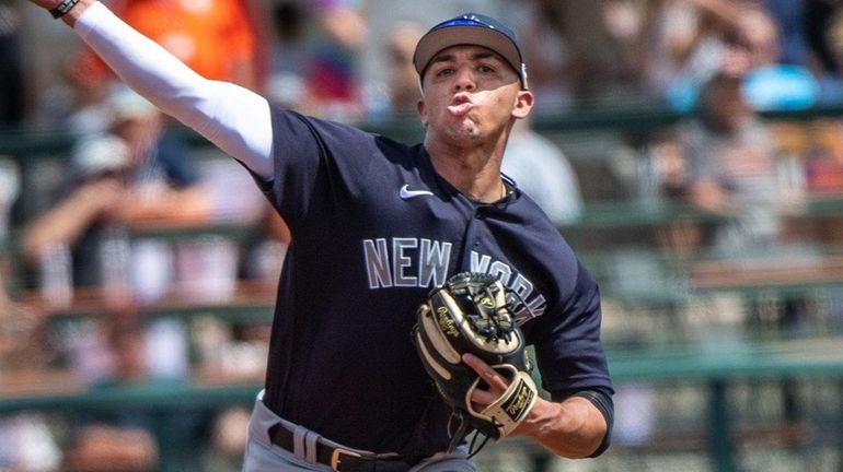 Yankees SS Oswald Peraza makes a play on the ball hit by...