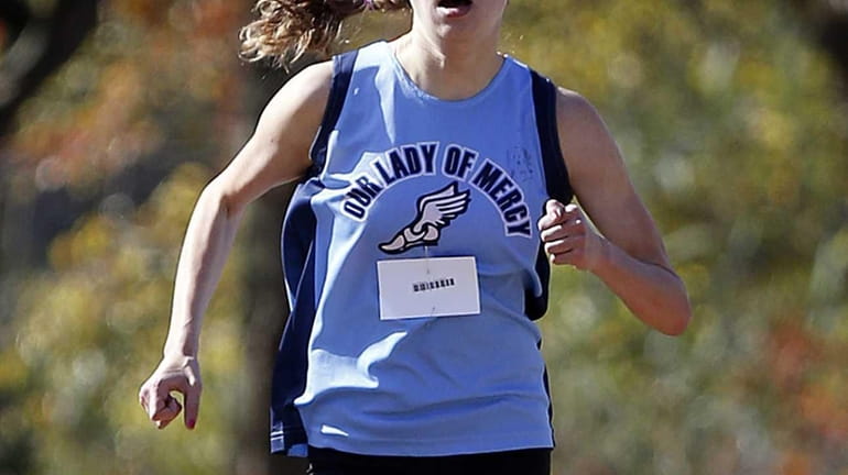 Tara Sweeney of Our Lady of Mercy finished first in...