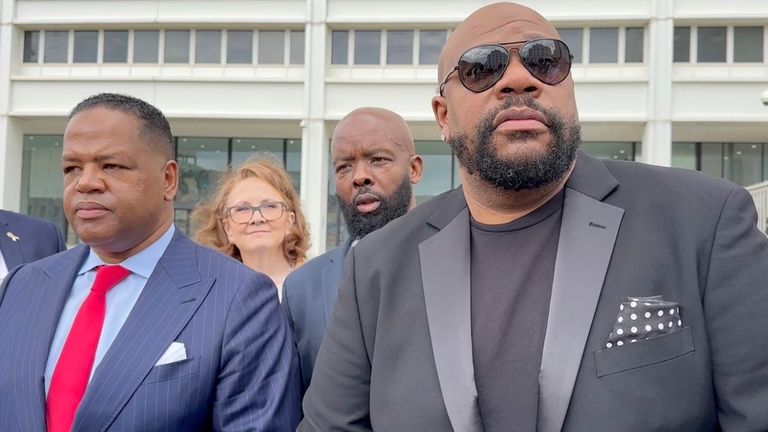 Isaac Hayes III, right, and his attorney address reporters outside...