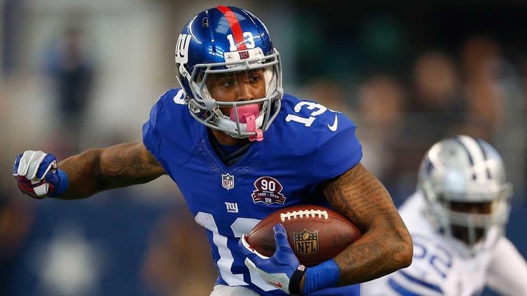 Giants rookie receiver Odell Beckham Jr. carries the ball after...