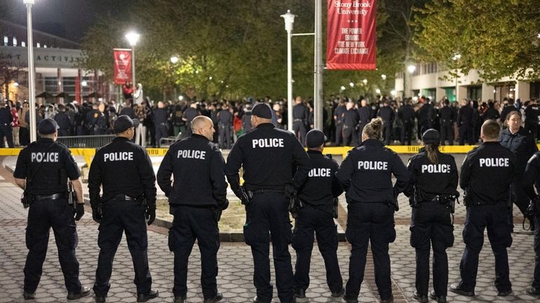 Police keep watch over a pro-Palestinian protest at Stony Brook...