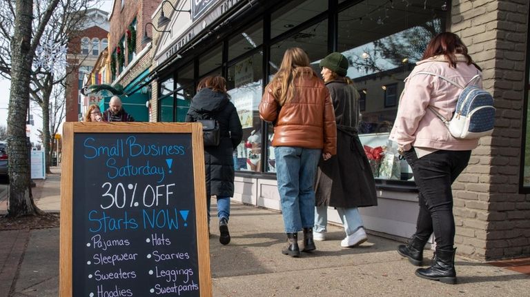 Shoppers along Main Street in Patchogue during Small Business Saturday.