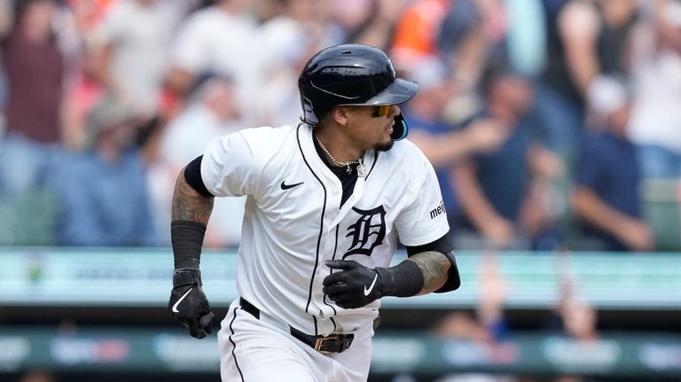 Detroit Tigers' Javier Báez watches his two-run home run during...