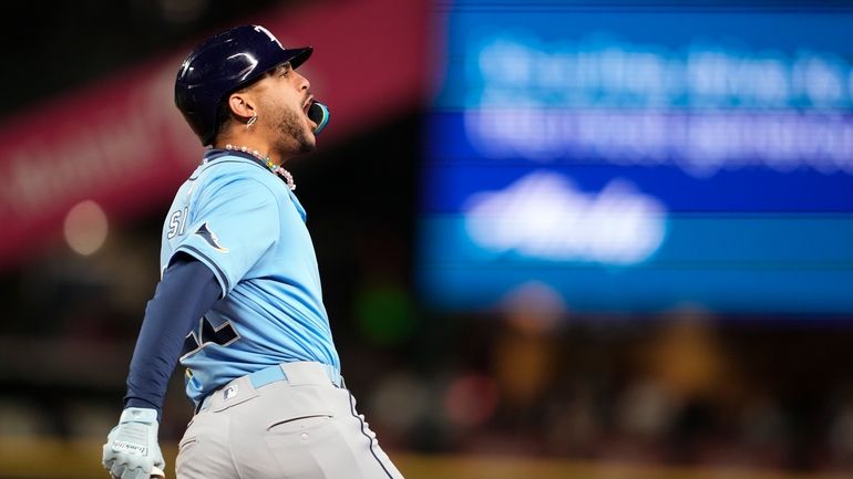 Tampa Bay Rays' Jose Siri reacts to hitting a two-run...