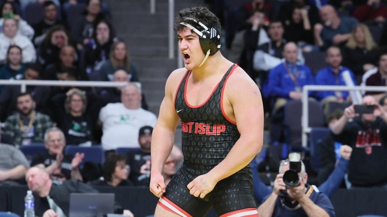 Sebastian Regis of East Islip pins Stephan Monchery of Middletown...