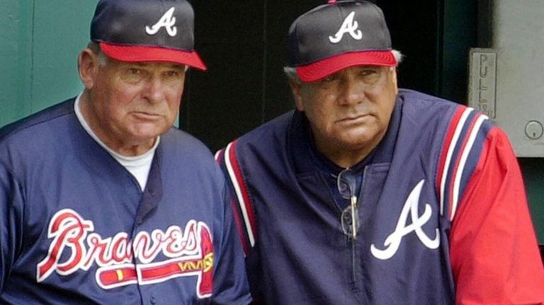 Atlanta Braves manager Bobby Cox, left, and coach Pat Corrales,...