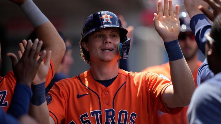 Houston Astros' Jake Meyers (6) celebrates in the dugout after...