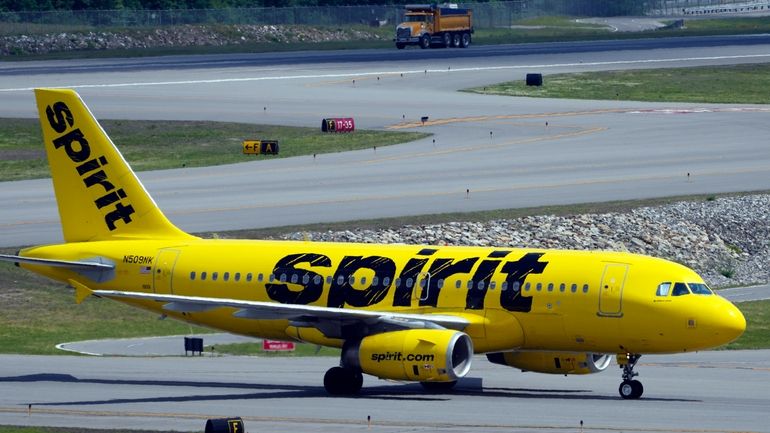 A Spirit Airlines 319 Airbus taxis at Manchester Boston Regional...