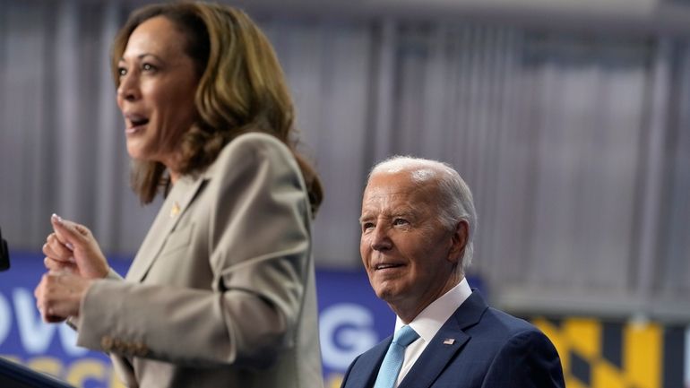 President Joe Biden, right, listens as Democratic presidential nominee Vice...