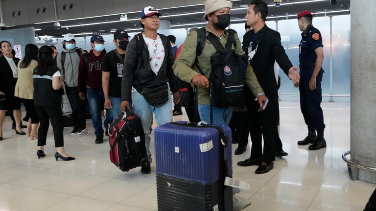 Thai workers who were evacuated from Israel arrive at Suvarnabhumi...
