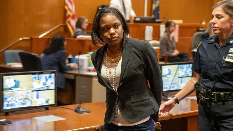 Jessica Beauvais is led from a Queens courtroom after being...