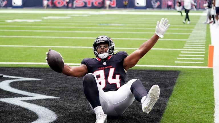 Houston Texans fullback Troy Hairston (34) celebrates after scoring on...