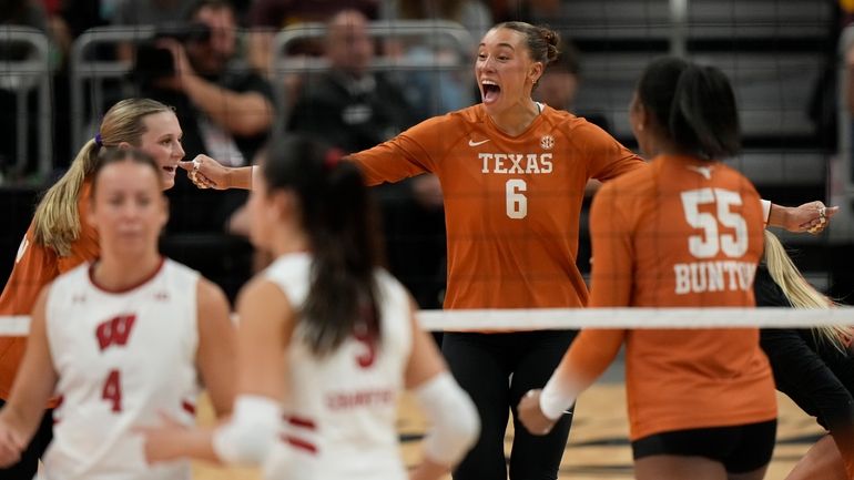 Texas' Madisen Skinner celebrates a point during an NCAA Division...