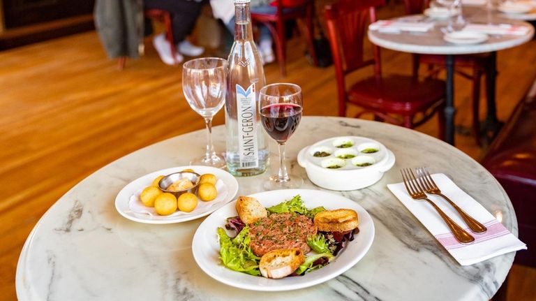 Steak tartare and escargots at Demarchelier Cafe and Bar in...