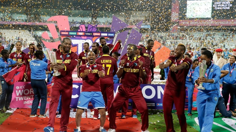 The West Indies men's and women's team celebrate after winning...