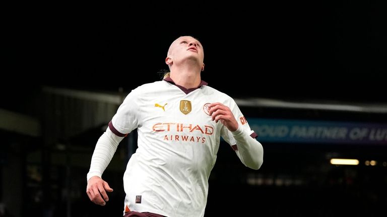 Manchester City's Erling Haaland celebrates after scoring his side's second...