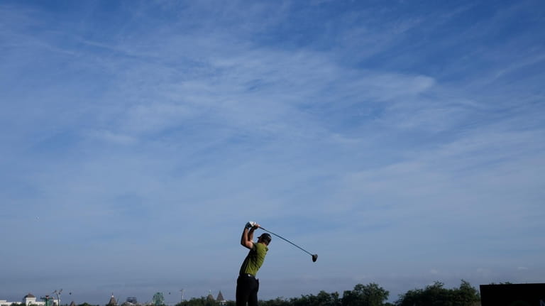 Austin Eckroat, of the United States, tees off on the...