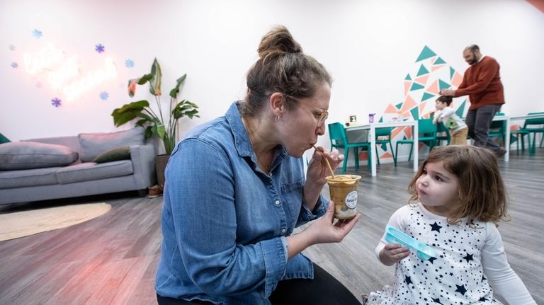 Stephanie Jablonsky of Lynbrook, with whipped coffee and daughter, Ilona...