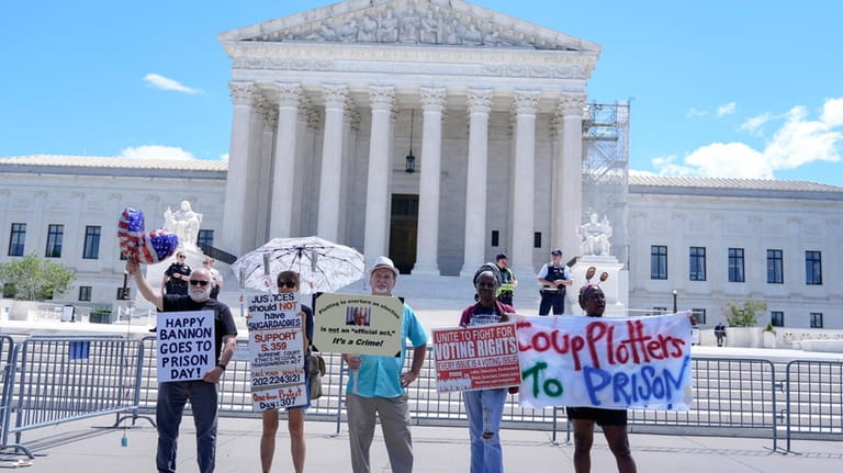 People protest outside the Supreme Court Monday, July 1, 2024,...