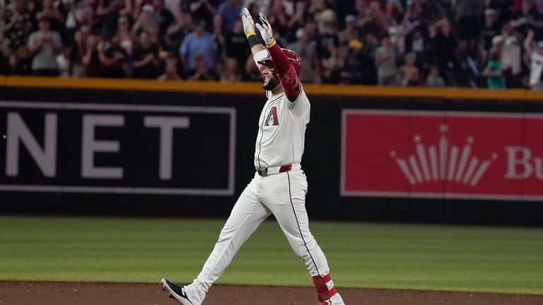 Arizona Diamondbacks' Eugenio Suárez celebrates his walk off RBI single...