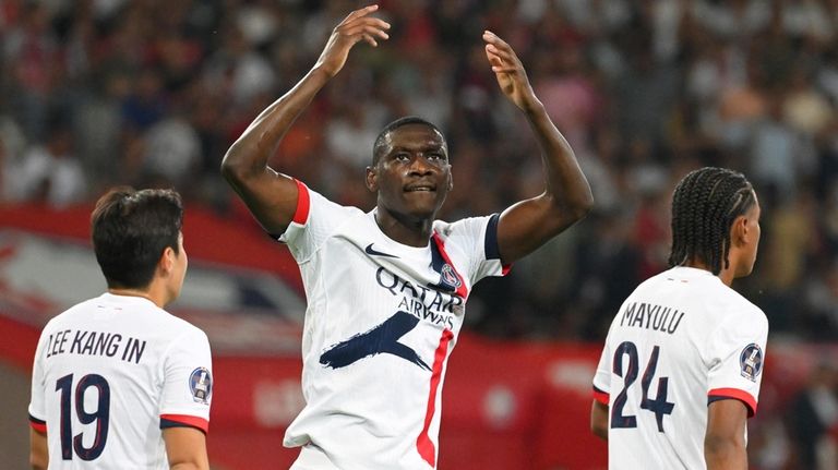 PSG's Randal Kolo Muani celebrates after scoring his side's third...