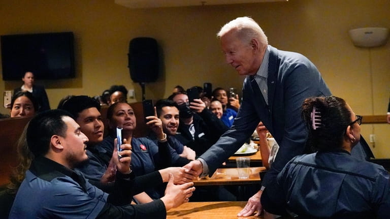 President Joe Biden meets with members of the Culinary Workers...