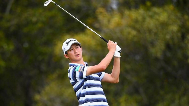 Japan's Rikuya Hoshino plays a shot during the third round...