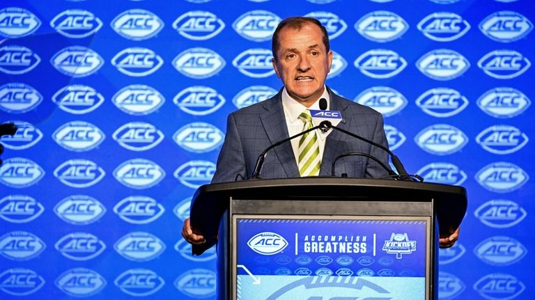 Atlantic Coast Conference commissioner Jim Phillips speaks during an NCAA...