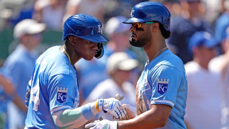 Kansas City Royals' MJ Melendez, right, celebrates with Dairon Blanco...