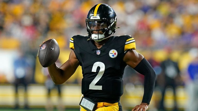 Pittsburgh Steelers quarterback Justin Fields runs with the ball during...