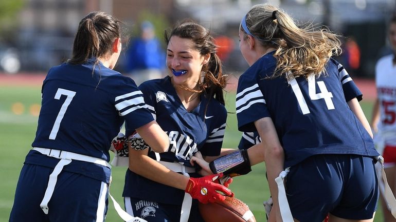 Plainview-Old Bethpage JFK's Lara Glasser, center, celebrates her touchdown catch with...