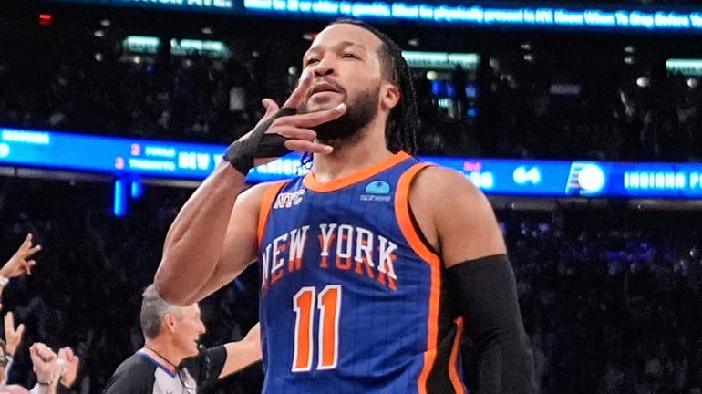 The Knicks' Jalen Brunson gestures to fans after making a...