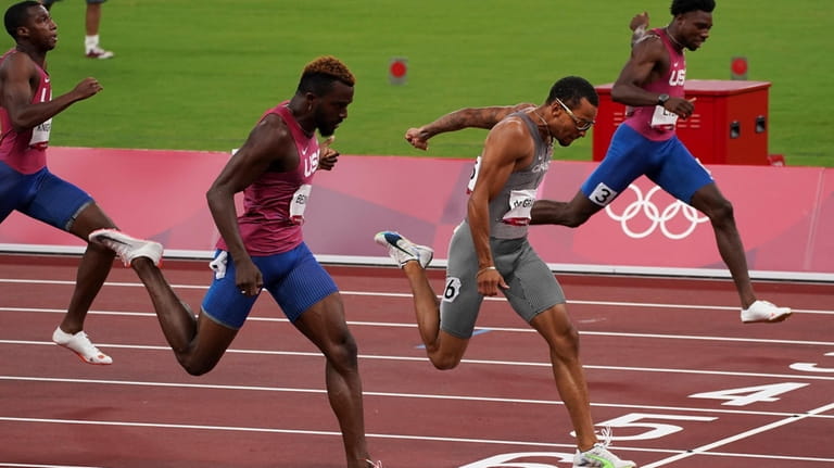 Andre De Grasse, of Canada, races to win the gold...