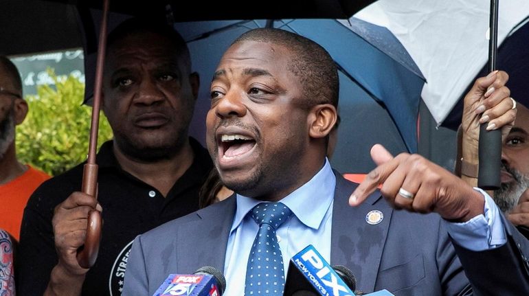 State Sen. Brian A. Benjamin in front of Alibi Lounge in...