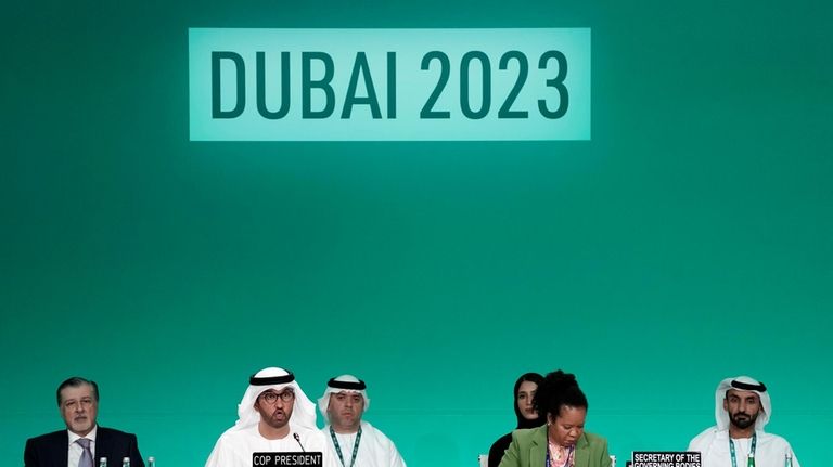 COP28 President Sultan al-Jaber, second from left, speaks during a...