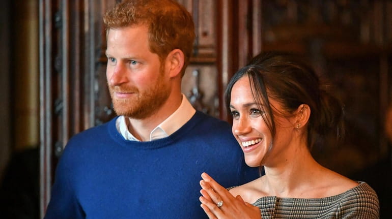  Prince Harry and Meghan Markle watch a performance by a...