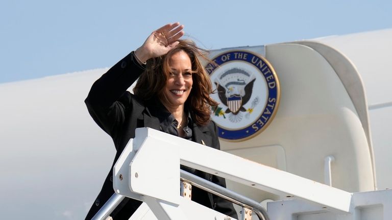 Democratic presidential nominee Vice President Kamala Harris waves to the...