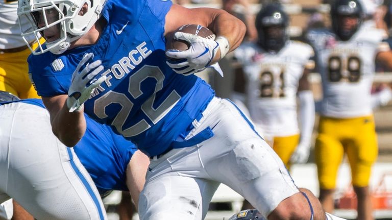 Air Force Falcons running back Owen Allen (22) runs down...