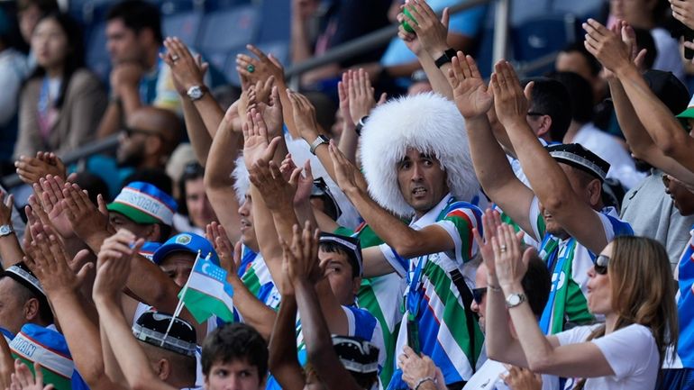 Uzbekistan fans react during the men's group C match between...