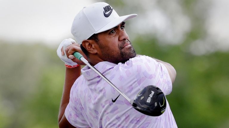 Defending champion Tony Finau tees off on the 10th hole...